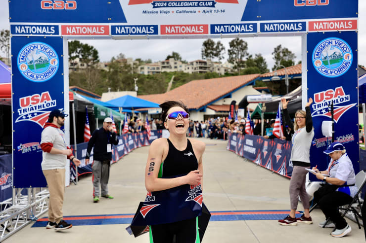 Faith Duncan runs through the finish line at Collegiate Club National Championships.